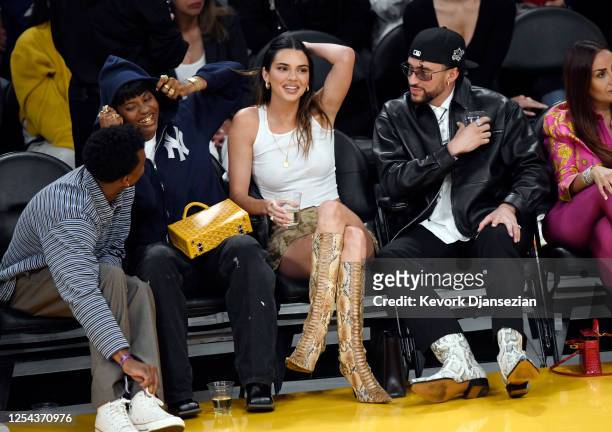 Yung Taco, Renell Medrano, Kendall Jenner and Bad Bunny attend the Western Conference Semifinal Playoff game between the Los Angeles Lakers and...