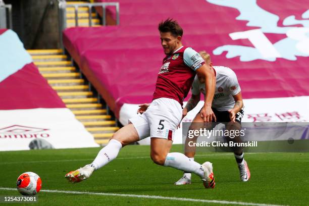 James Tarkowski of Burnley scores his team's first goal during the Premier League match between Burnley FC and Sheffield United at Turf Moor on July...