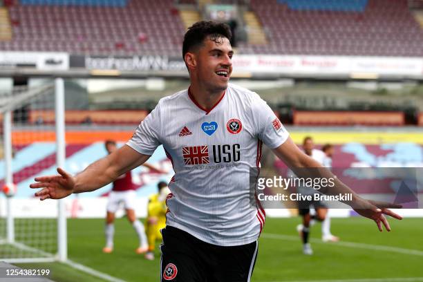 John Egan of Sheffield United celebrates after scoring his team's first goal during the Premier League match between Burnley FC and Sheffield United...