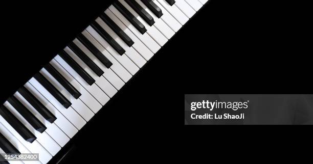 piano and piano keyboard with black backgrounds. - piano keys stock pictures, royalty-free photos & images