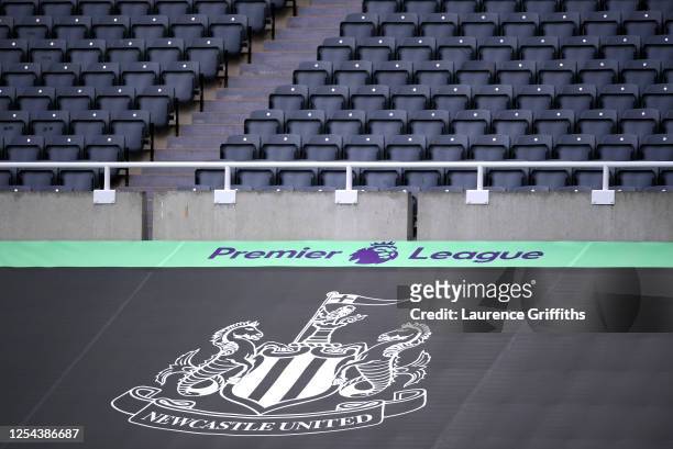 General view inside the stadium where a Newcastle United banner is seen alongside the Premier League logo prior to the Premier League match between...