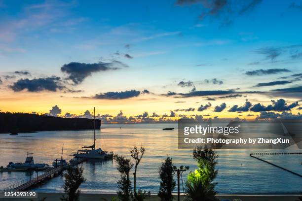 okinawa skyline at sunset. - okinawa blue sky beach landscape stock-fotos und bilder