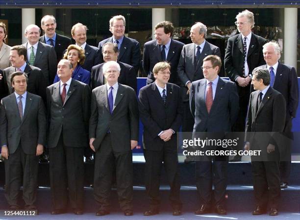 The space reserved to Belgian Foreign Minister Louis Michel stays empty behind Belgian Prime Minister Guy Verhofstadt and Danish Prime Minister Poul...