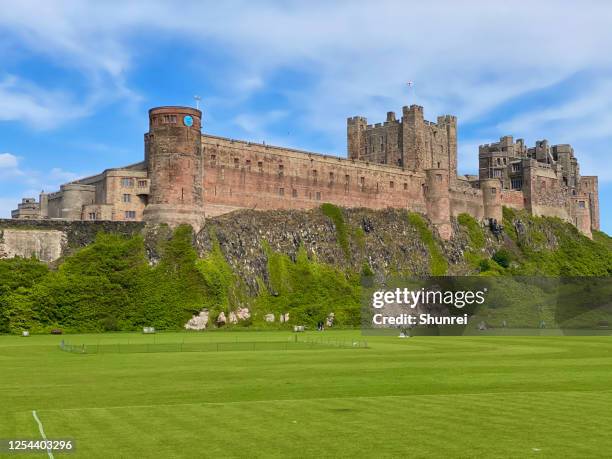 bamburgh castle, england - bamburgh castle stock pictures, royalty-free photos & images