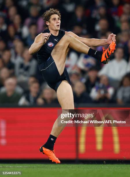 Charlie Curnow of the Blues kicks the ball during the 2023 AFL Round 09 match between the Carlton Blues and the Western Bulldogs at Marvel Stadium on...