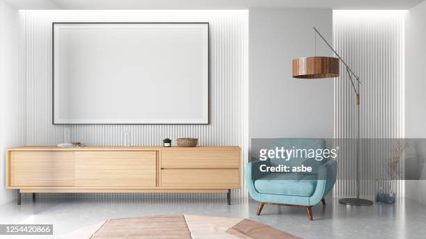 modern huiskamerinterieur met leeg frame - tv on wall stockfoto's en -beelden