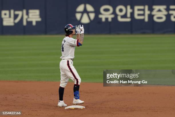 Infielder Oh Jae-Won of Doosan Bears reacts at second base after hits a RBI double to make the score 6-4 in the bottom of the seventh inning during...