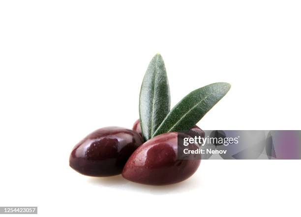 black olive fruits isolated on white background - aceituna negra fotografías e imágenes de stock