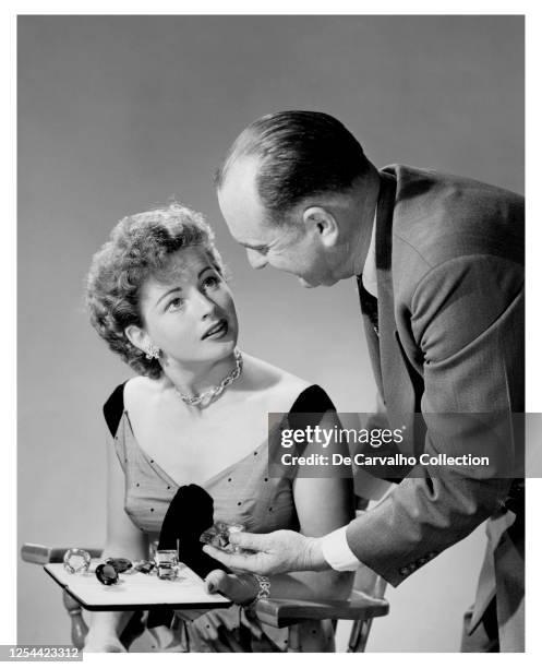Actress Coleen Gray is being shown a collection of semi-precious stones worth $40,000 by the president of the American Gem and Mineral Association,...