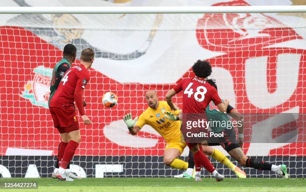 Curtis Jones of Liverpool scores his team's second goal past Pepe Reina of Aston Villa during the Premier League match between Liverpool FC and Aston...