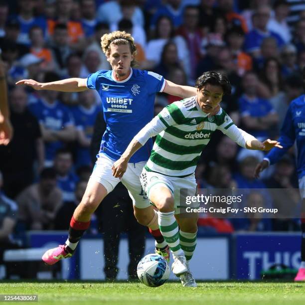 Reo Hatate and Todd Cantwell in action during a cinch Premiership match between Rangers and Celtic at Ibrox Stadium, on May 13 in Glasgow, Scotland.