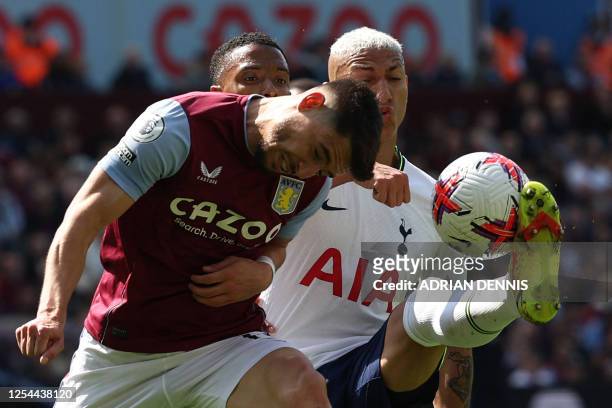 Aston Villa's Spanish defender Alex Moreno fights for the ball with Tottenham Hotspur's Brazilian striker Richarlison next to Aston Villa's English...