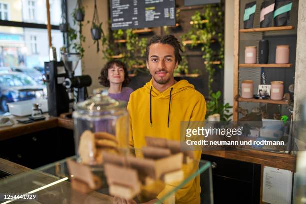 portrait of confident cafe owner couple, berlin, germany 2020 - bakning business bildbanksfoton och bilder