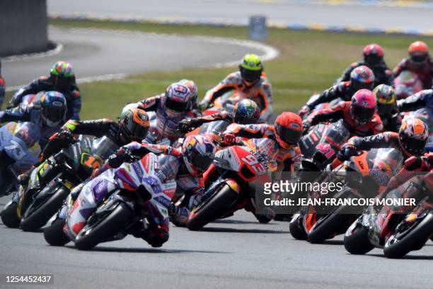 Prima Pramac Racing's Spanish rider Jorge Martin takes a position at the start in front of Repsol Honda Team's Spanish rider Marc Marquez during the...