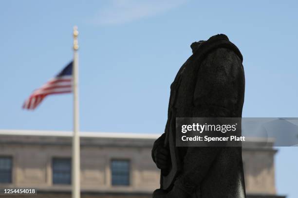 The headless statue of Christopher Columbus stands outside of Waterbury’s city hall on July 05, 2020 in Waterbury, Connecticut. The decapitated...