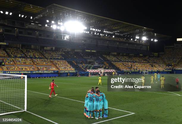 Antoine Griezmann of Barcelona celebrates after scoring his sides third goal with team mates during the Liga match between Villarreal CF and FC...