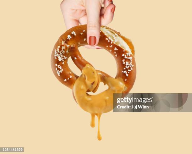 pretzel with dip - dip stockfoto's en -beelden