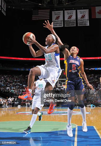 Cappie Pondexter of the New York Liberty shoots the basketball against Tangela Smith of the Indiana Fever in Game Two of the Eastern Conference...