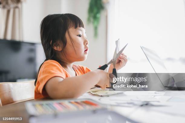 girl making a craft with scissors - scissors stock pictures, royalty-free photos & images
