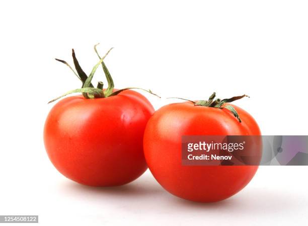 juicy red tomatoes isolated on white background - tomato stockfoto's en -beelden