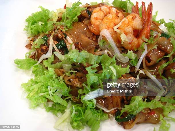 malaysian local fried noodles - char kway teow stock pictures, royalty-free photos & images