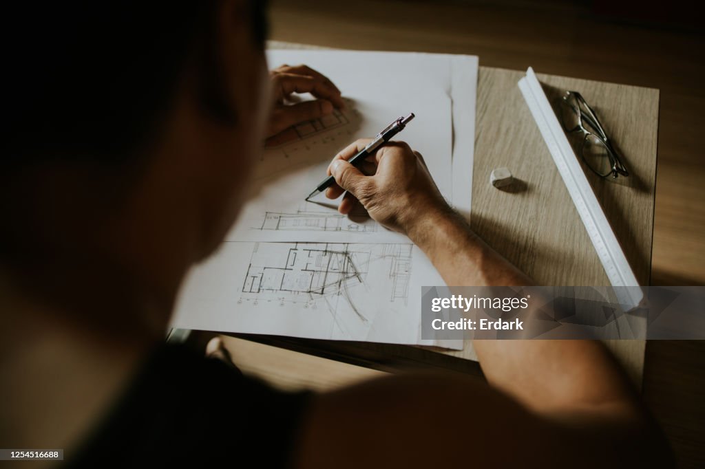 Artchitect Freelancer man drawing and designing home