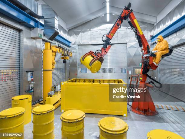 storage of nuclear waste barrels - uranio fotografías e imágenes de stock