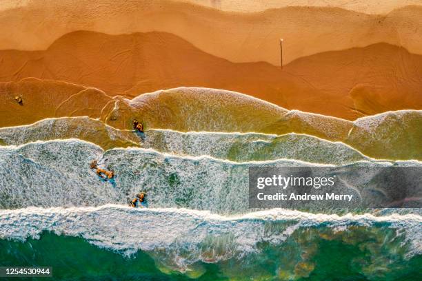 beach, sand, sea, waves and coastline in australia, aerial view - tide foto e immagini stock