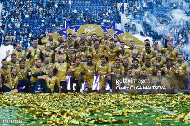 Zenit's players pose with medals during an award ceremony at the Gazprom Arena stadium in Saint Petersburg on May 13, 2023. FC Zenit claimed the 10th...