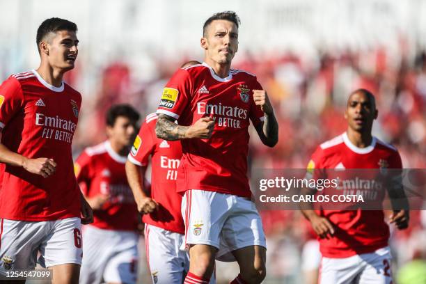 Benfica's Spanish midfielder Alex Grimaldo celebrates after scoring a goal during the Portuguese League football match between Portimonense SC and SL...