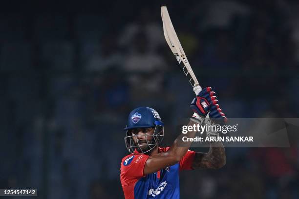 Delhi Capitals' Aman Hakim Khan plays a shot during the Indian Premier League Twenty20 cricket match between Delhi Capitals and Punjab Kings at the...