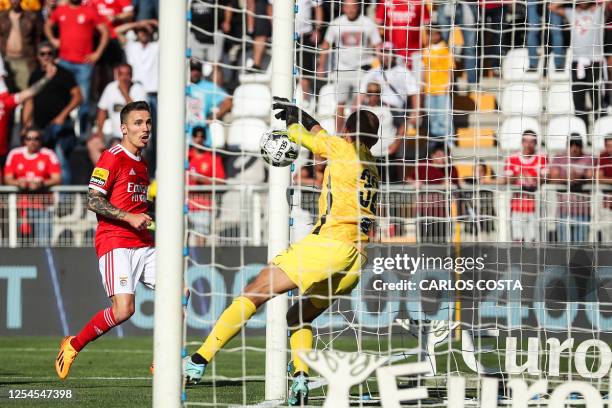 Benfica's Spanish midfielder Alex Grimaldo scores a goal during the Portuguese League football match between Portimonense SC and SL Benfica at the...