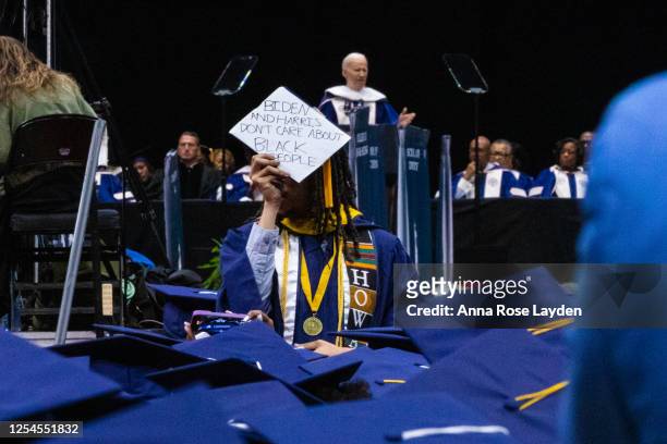 Students protest as US President Joe Biden addresses the graduating class of Howard University during the 2023 Commencement Ceremony at Capitol One...