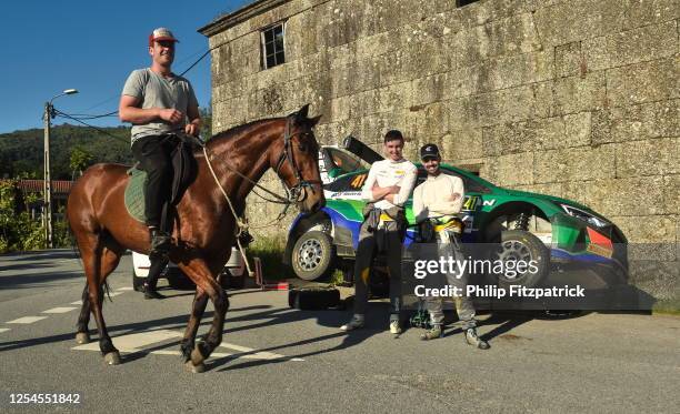 Porto , Portugal - 13 May 2023; A local machanics with his horse passes by Eamonn Kelly and Conor Mohan of Ireland, Hyundai i20 N, during day three...