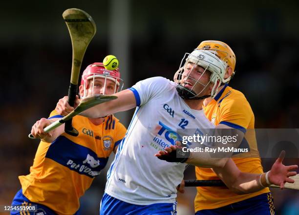 Tipperary , Ireland - 13 May 2023; Neil Montgomery of Waterford is tackled by John Conlon, left, and David Fitzgerald of Clare during the Munster GAA...