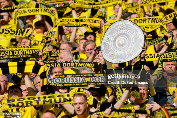 Borussia Dortmund Fans with a championship trophy during the Bundesliga match between Borussia Dortmund and Borussia Mönchengladbach at Signal Iduna...