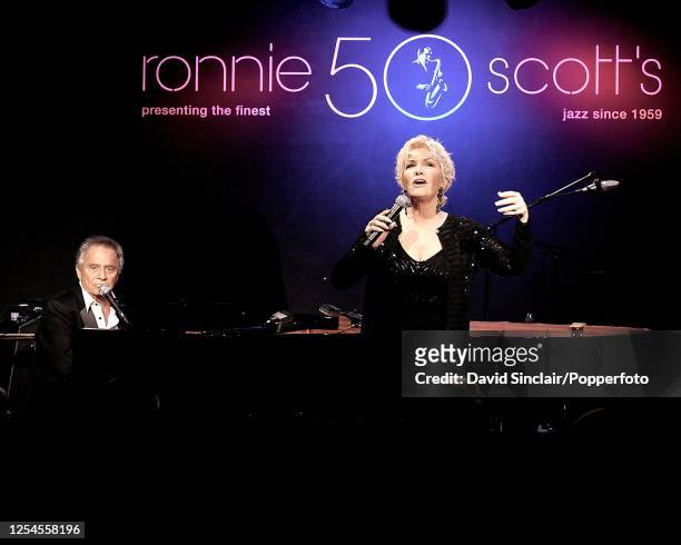 American singer and pianist Buddy Greco performs live on stage with singer Lezley Anders at Ronnie Scott's Jazz Club in Soho, London on 18th June...