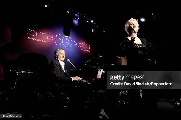 American singer and pianist Buddy Greco performs live on stage with singer Lezley Anders at Ronnie Scott's Jazz Club in Soho, London on 18th June...