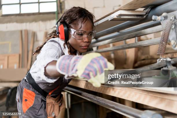 working with wood - ear defenders stock pictures, royalty-free photos & images