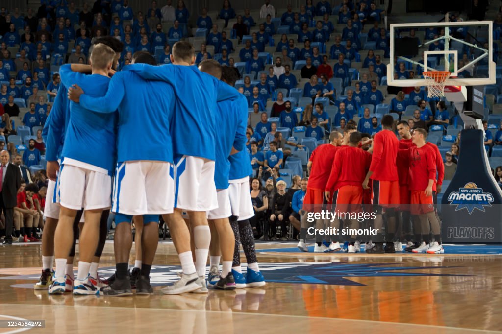 Basketball players discussing strategy