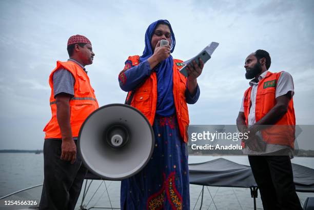 Volunteers of Cyclone Preparedness Programme use a megaphone while alerting inhabitants for evacuating to Safe Places at the Major City of Barishal...