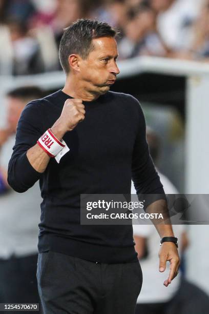 Benfica's German head coach Roger Schmidt celebrates the victory at the end of the Portuguese League football match between Portimonense SC and SL...