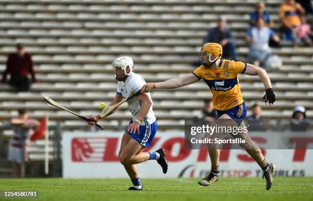 Tipperary , Ireland - 13 May 2023; Neil Montgomery of Waterford in action against David Fitzgerald of Clare during the Munster GAA Hurling Senior...
