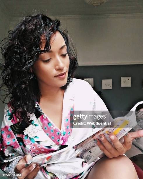 south african women reading a magazine during quarantine - webfluential bildbanksfoton och bilder