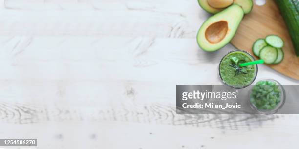 fresh green detox smoothie - avocado smoothie stock pictures, royalty-free photos & images