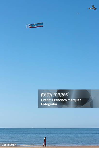 beach - airplane banner stock pictures, royalty-free photos & images