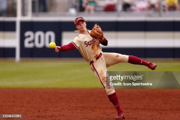 Florida State Seminoles Josie Muffley makes the off balance throw to first for the out during the ACC Tournament Championship between the Duke Blue...