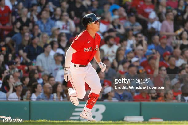 Rob Refsnyder of the Boston Red Sox watches his two-run double against the St. Louis Cardinals during the third inning at Fenway Park on May 13, 2023...