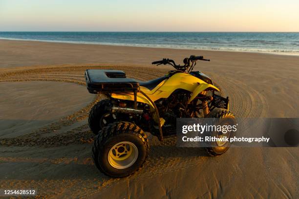 quad bike at seashore - quadbike stock pictures, royalty-free photos & images