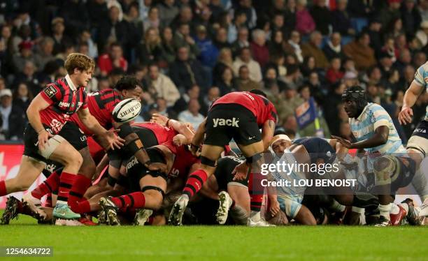 Toulon's French scrum-half Jules Danglot clears the ball during the French Top14 rugby union match between Racing 92 and Rugby Club Toulonnais at the...